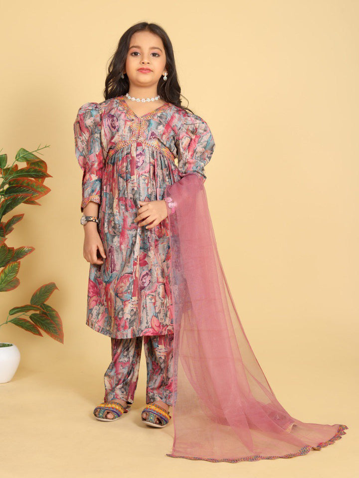 child girl posing in pink traditional dress